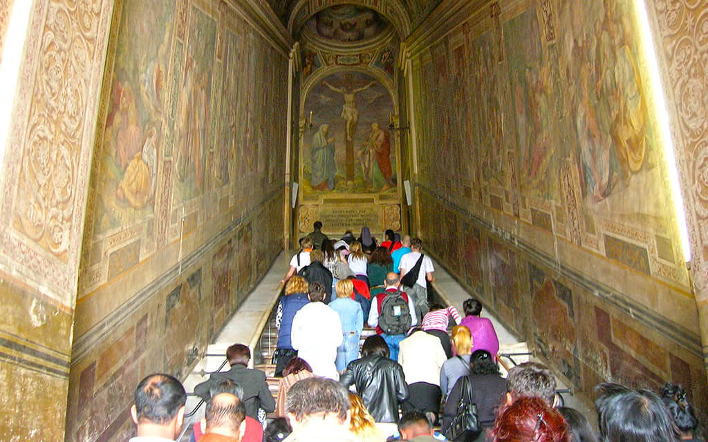 Faithful pilgrims ascend the Scala Sancta on their knees